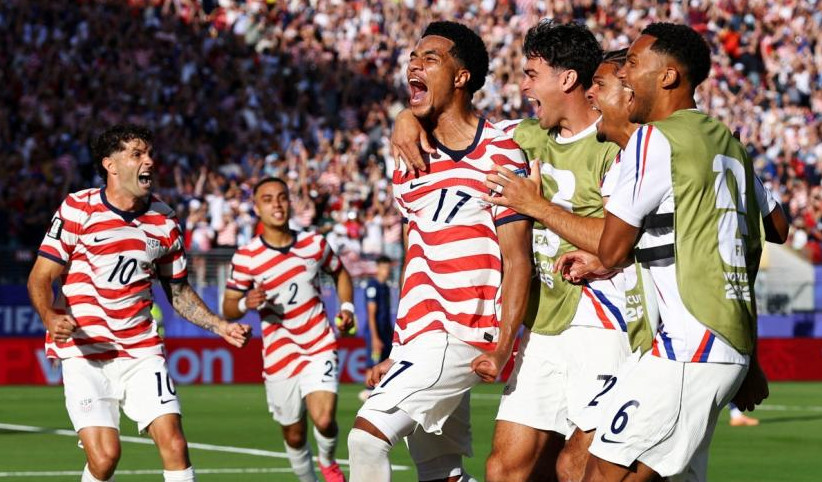 US Midfielder Malik Tillman celebrates scoring their second goal with teammates.  (Image: Carlos Barria/Reuters)