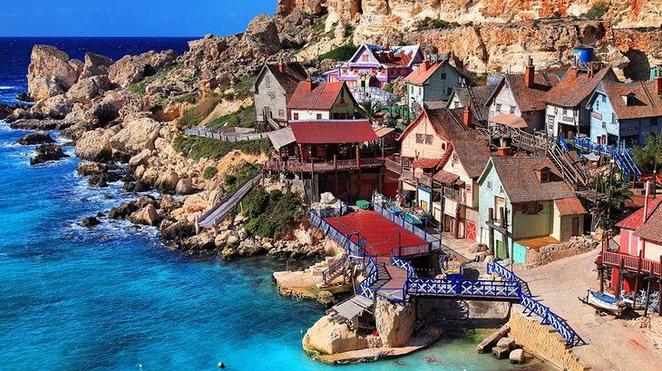 Film set from the 1980 musical 'Popeye', now a theme park village with boat rides & food outlets. Film set from the 1980 musical 'Popeye', now a theme park village with boat rides & food outlets.